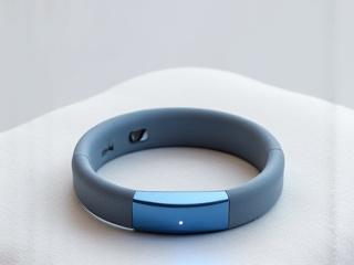 Modern smart sleep tracker wrist device on a minimalist background